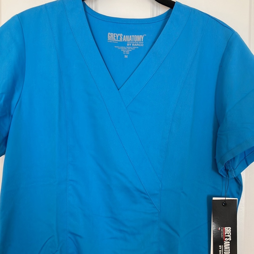 Grey’s Anatomy 2 Pocket Mock Wrap Top - Picture 3 of 5